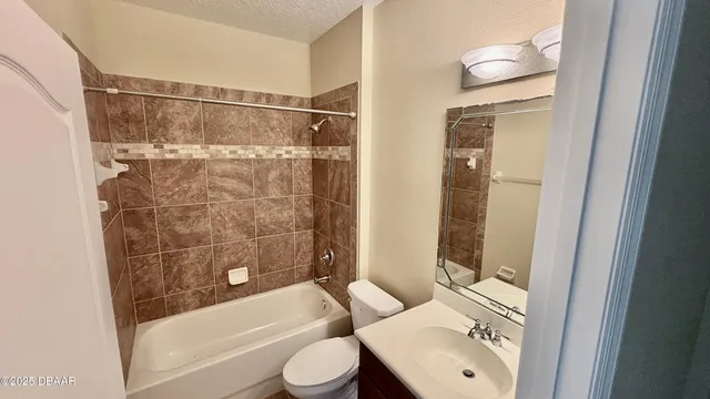 a bathroom with a toilet and a bathtub