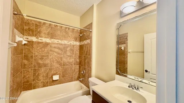 a bathroom with a sink and shower