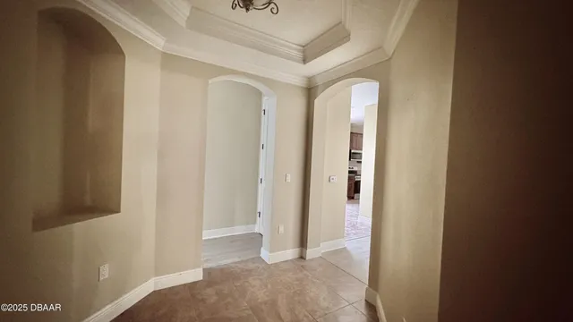 a view of a hallway with wooden shelves