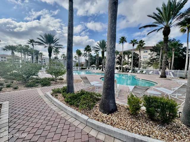 a view of a backyard of the house