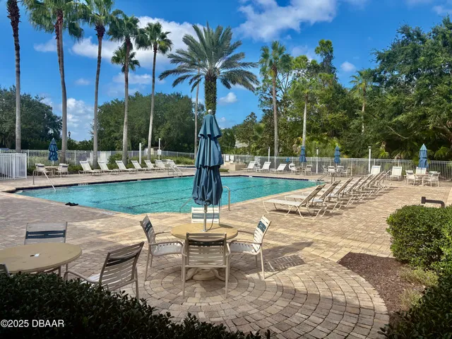 a huge green field with lots of trees