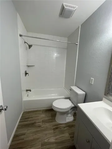 a bathroom with a sink toilet a mirror and shower