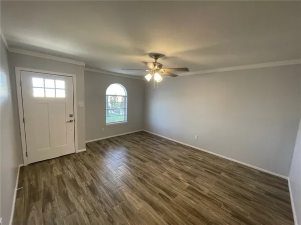 wooden floor in an empty room with a mirror