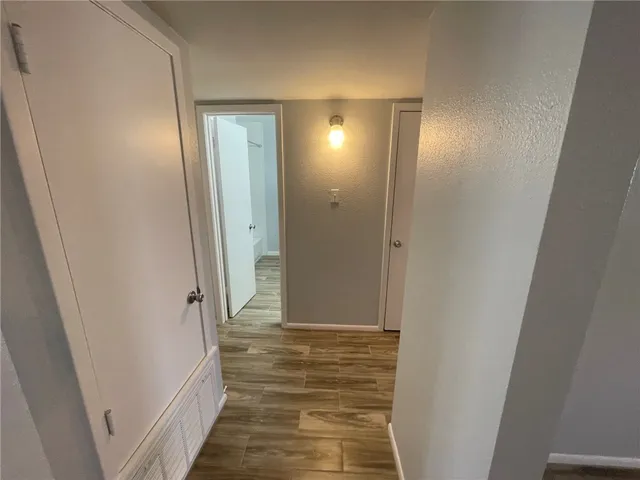 a view of a bathroom from a hallway