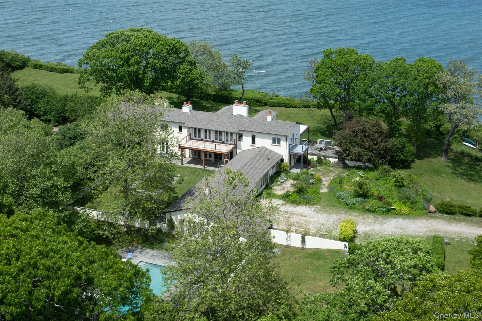 2840 Stars Road East Marion, NY 11939 - Photo 41 of 43 an aerial view of a house with a yard and outdoor seating