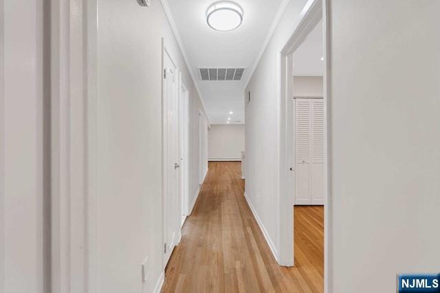 32 Rock Road Englewood Cliffs, NJ 07632 - Photo 18 of 30 a view of a hallway with wooden floor and staircase