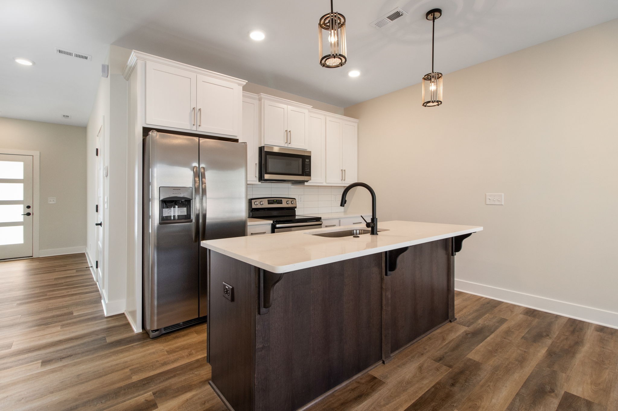 160 Excell Road, Unit D Clarksville, TN 37043 - Photo 13 of 34 a kitchen with kitchen island a sink stainless steel appliances and cabinets