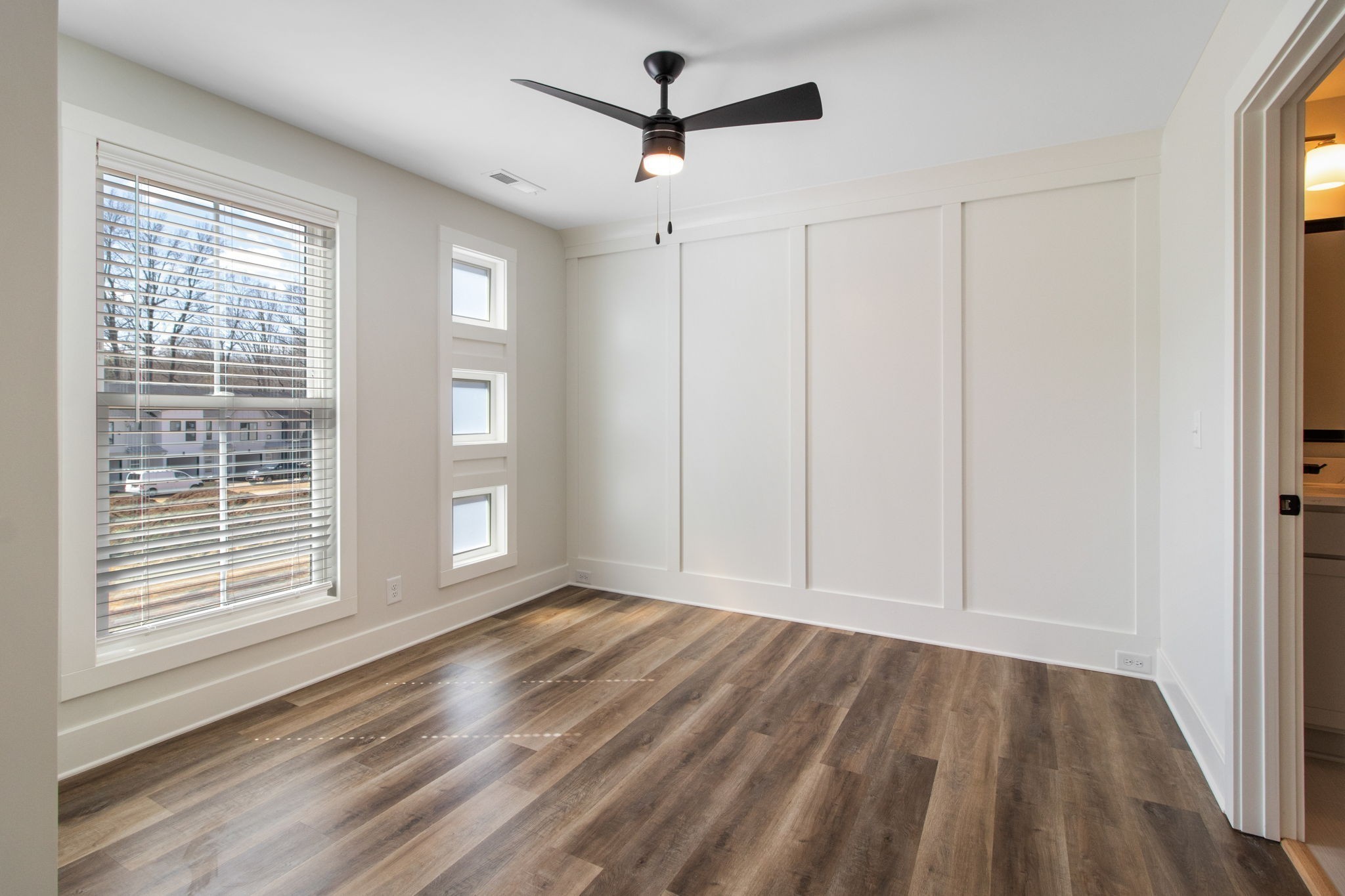 160 Excell Road, Unit D Clarksville, TN 37043 - Photo 18 of 34 a view of empty room with wooden floor and fan