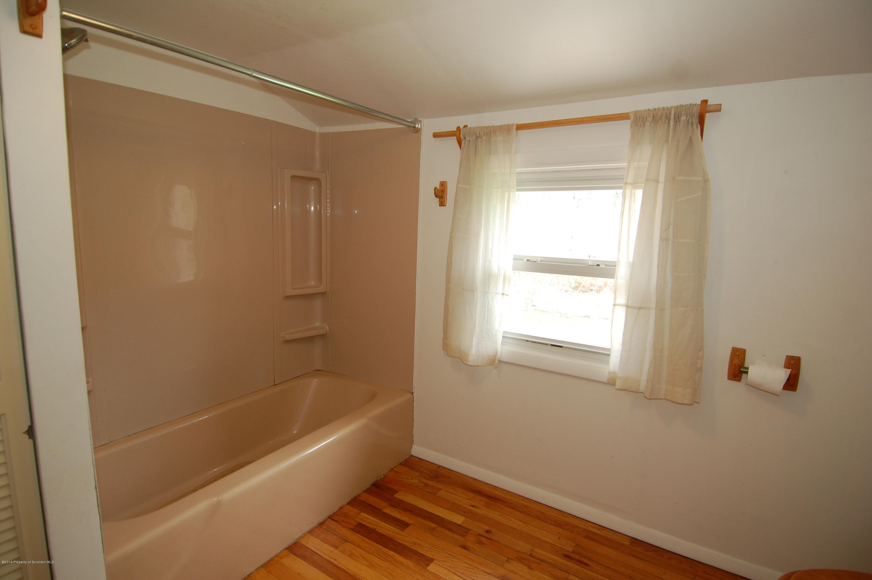 1129 Corbin Road Kingsley, PA 18826 - Photo 15 of 24 a bathroom with a bathtub