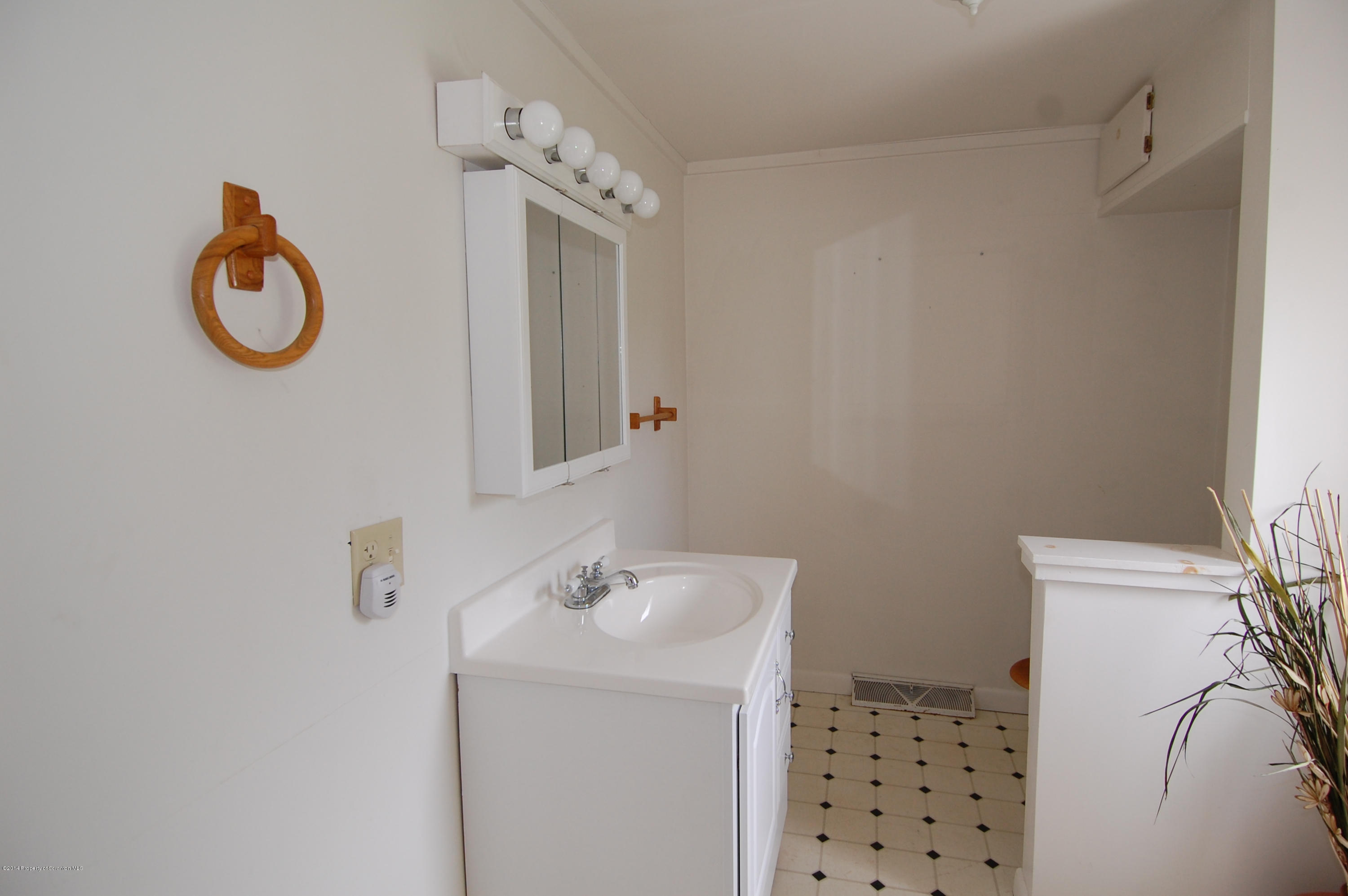 1129 Corbin Road Kingsley, PA 18826 - Photo 17 of 24 a bathroom with a sink and a mirror