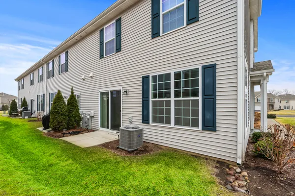 a view of a house with a yard and plants