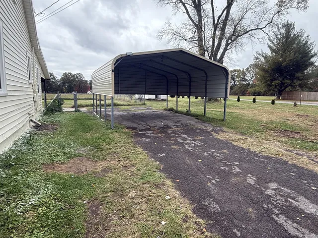 a view of a small yard in front of a house