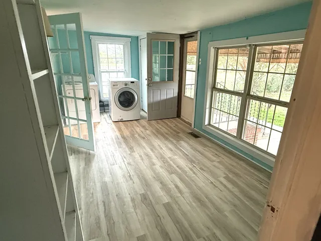 a view of an empty room with a window