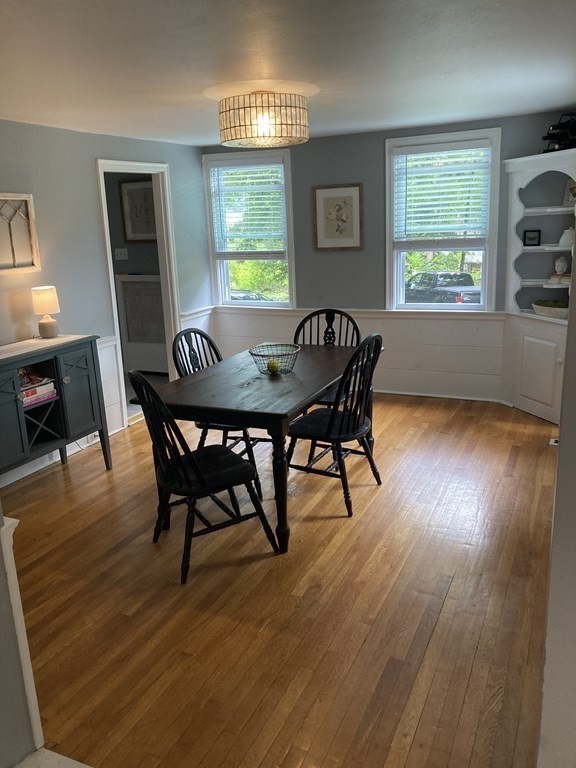 24 Baxter Street Worcester, MA 01602 - Photo 11 of 36 a view of a dining room with furniture window and wooden floor