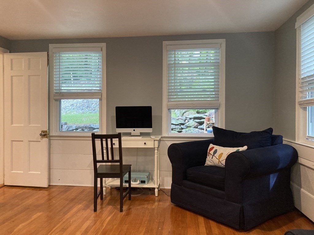 24 Baxter Street Worcester, MA 01602 - Photo 13 of 36 a living room with furniture and a flat screen tv