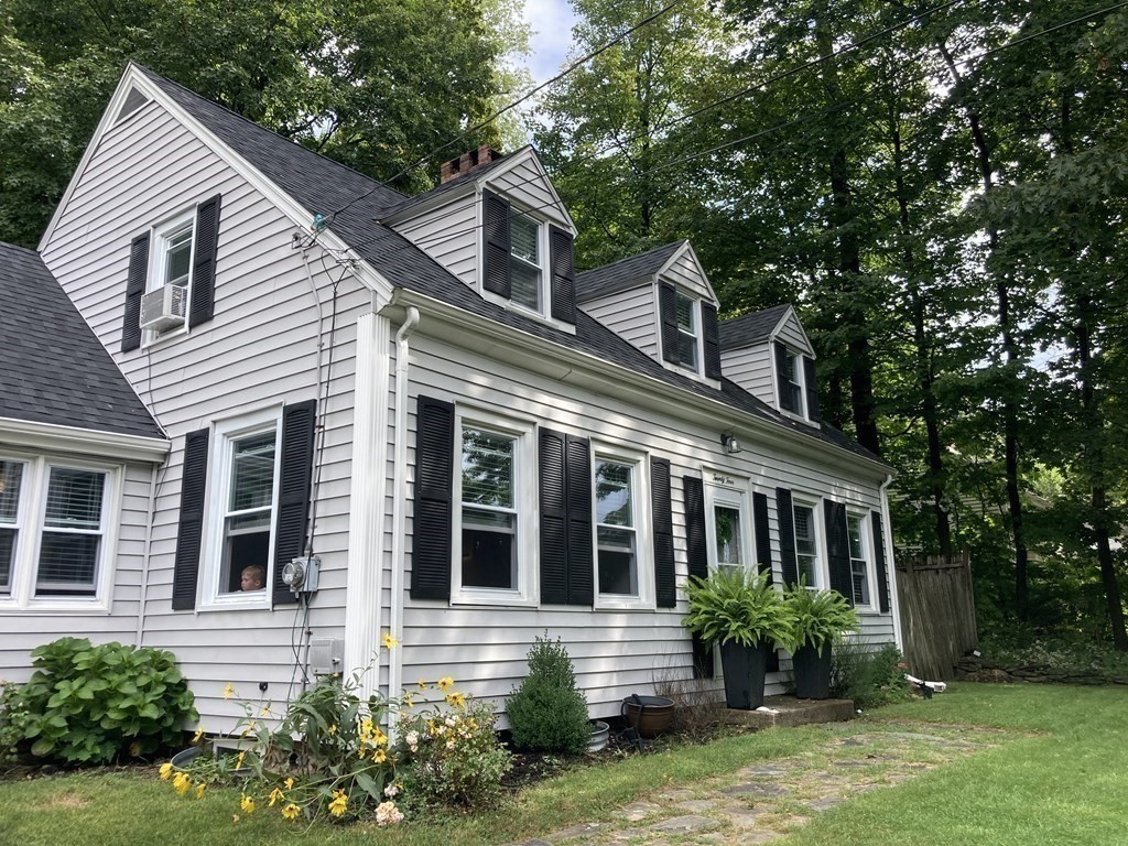 24 Baxter Street Worcester, MA 01602 - Photo 2 of 36 a front view of a house with garden