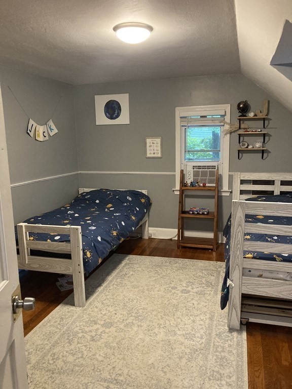 24 Baxter Street Worcester, MA 01602 - Photo 23 of 36 a bedroom with a bed and a window