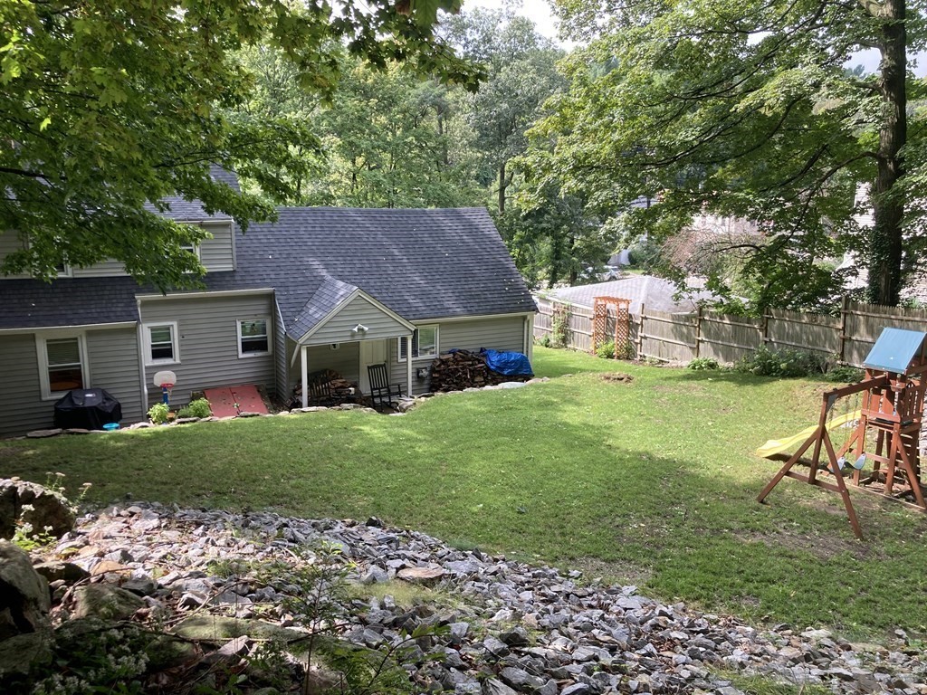 24 Baxter Street Worcester, MA 01602 - Photo 31 of 36 a house that is sitting in the grass