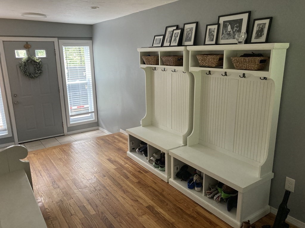 24 Baxter Street Worcester, MA 01602 - Photo 6 of 36 a living room with a bed and a table