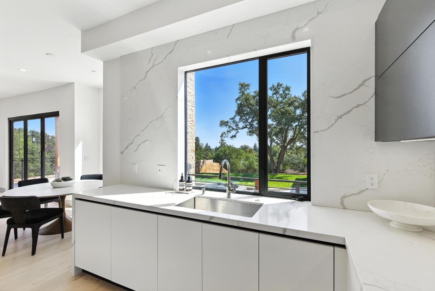1127 Hillslope Place Los Altos, CA 94024 - Photo 17 of 70 a bathroom with a double vanity sink and a large mirror