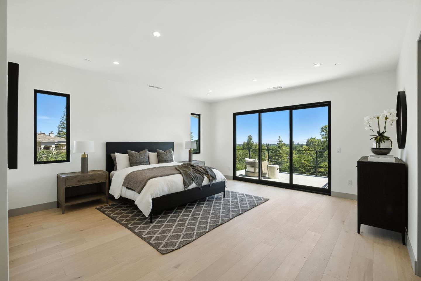 1127 Hillslope Place Los Altos, CA 94024 - Photo 25 of 70 a spacious bedroom with a large bed and a large window