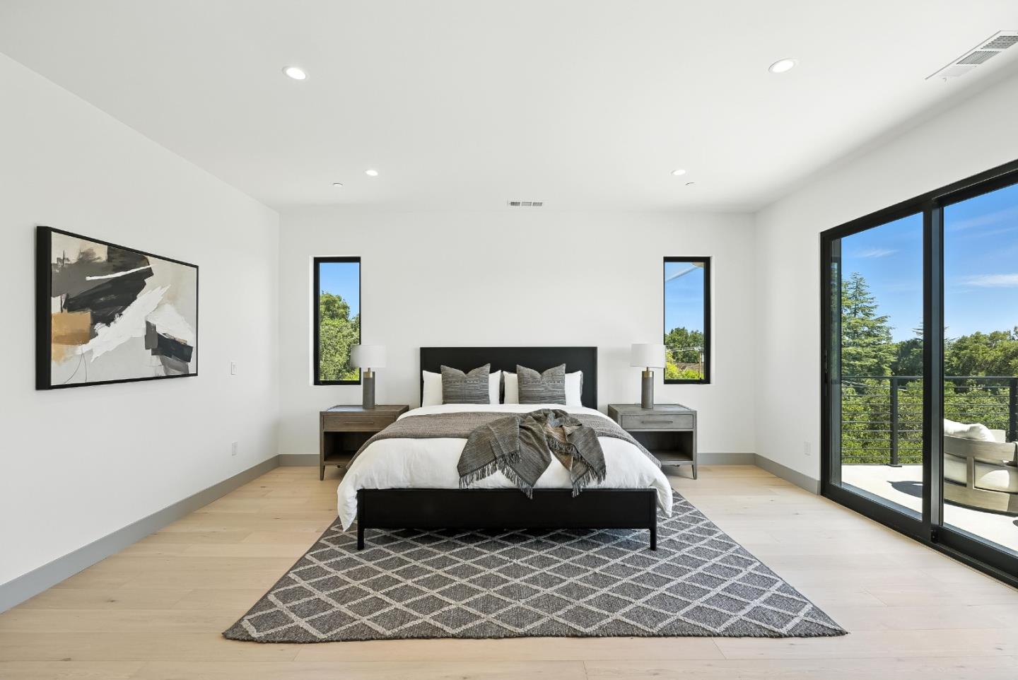 1127 Hillslope Place Los Altos, CA 94024 - Photo 29 of 70 a bedroom with a large bed rug and a large window