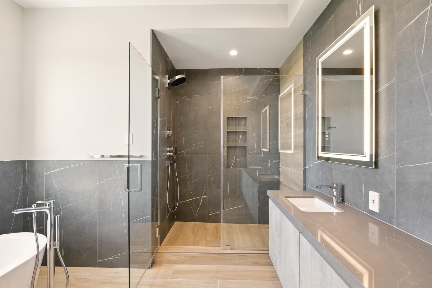 1127 Hillslope Place Los Altos, CA 94024 - Photo 32 of 70 a bathroom with a granite countertop sink mirror bathtub and shower
