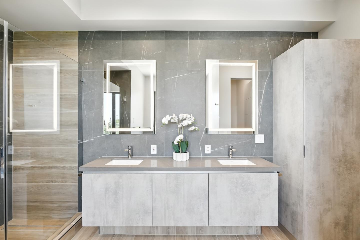 1127 Hillslope Place Los Altos, CA 94024 - Photo 34 of 70 a bathroom with a double vanity sink and a mirror