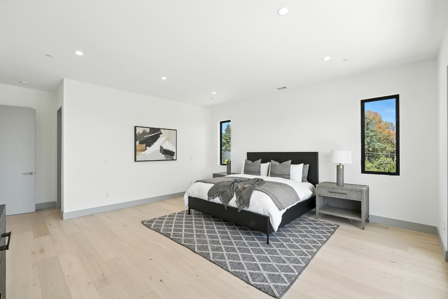 1127 Hillslope Place Los Altos, CA 94024 - Photo 35 of 70 a bedroom with a large bed and a couch