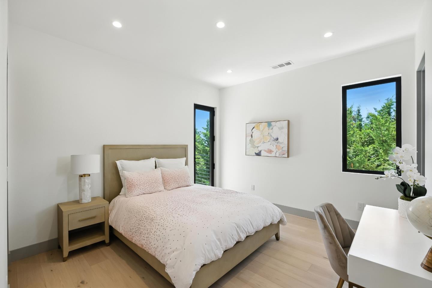 1127 Hillslope Place Los Altos, CA 94024 - Photo 37 of 70 a bedroom with a bed and a chair
