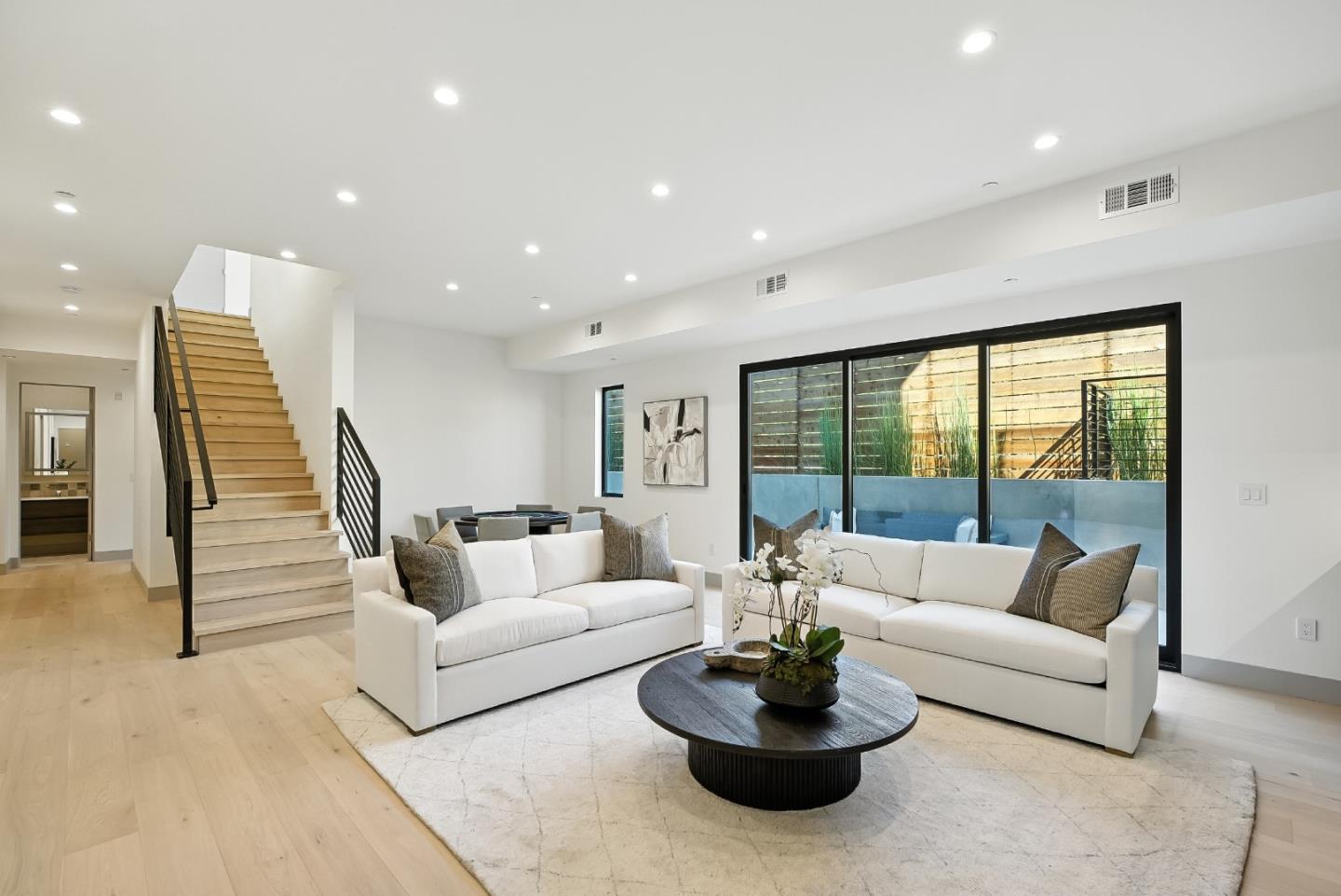 1127 Hillslope Place Los Altos, CA 94024 - Photo 45 of 70 a living room with furniture and a large window
