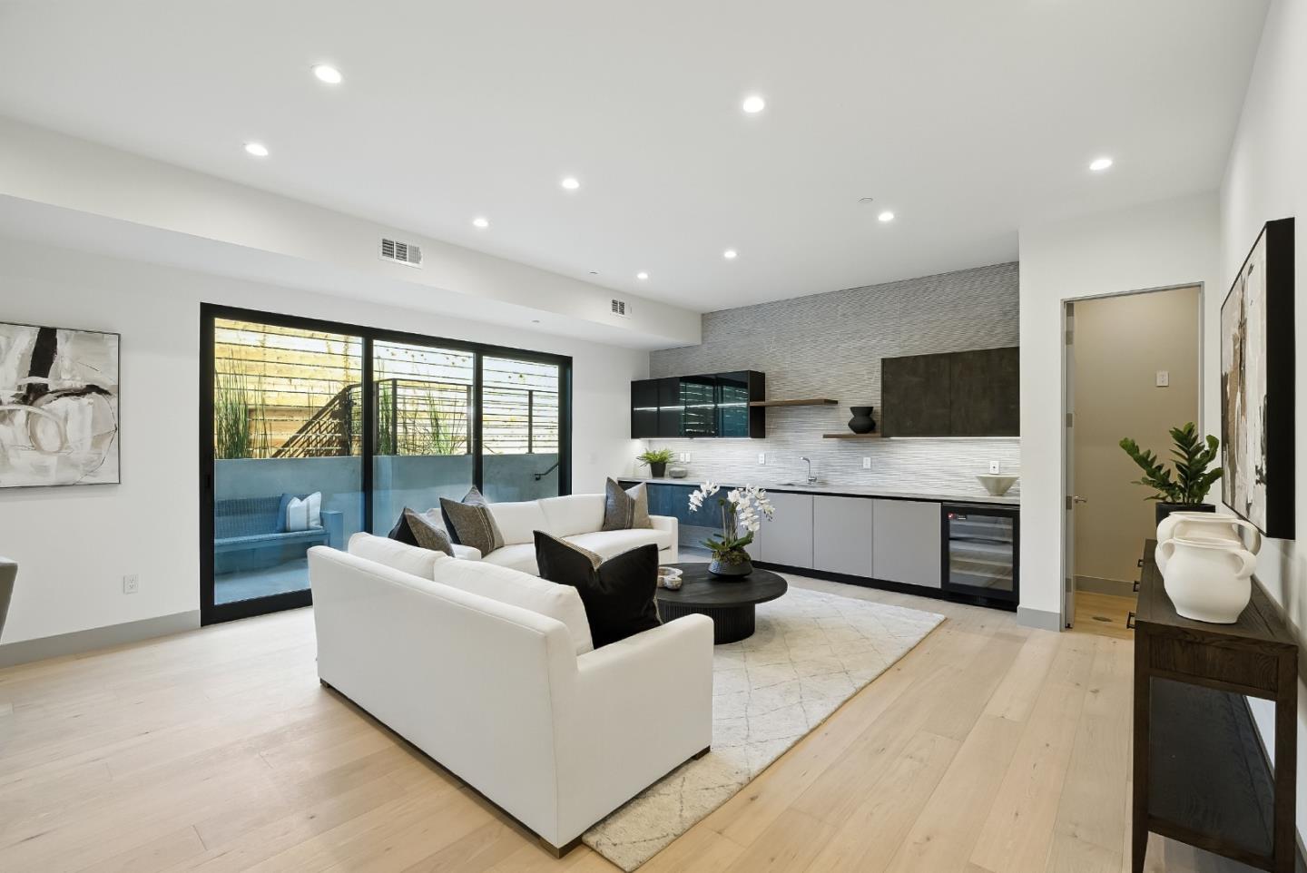 1127 Hillslope Place Los Altos, CA 94024 - Photo 49 of 70 a living room with furniture a large window and a flat screen tv