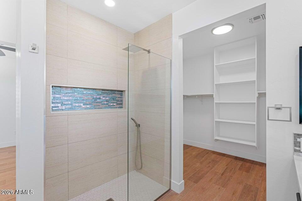 14833 South Brook Hollow Road Arizona City, AZ 85123 - Photo 27 of 61 a bathroom with a shower and a glass door