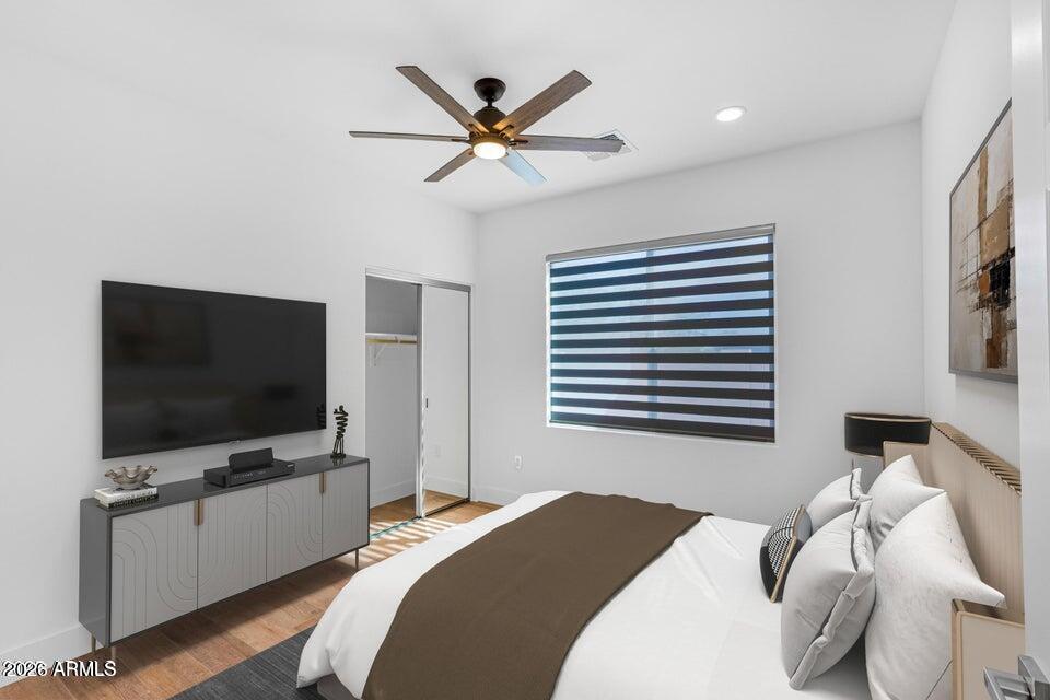 14833 South Brook Hollow Road Arizona City, AZ 85123 - Photo 29 of 61 a bedroom with a bed and a flat screen tv