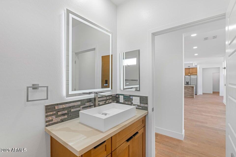 14833 South Brook Hollow Road Arizona City, AZ 85123 - Photo 31 of 61 a bathroom with a sink and a mirror