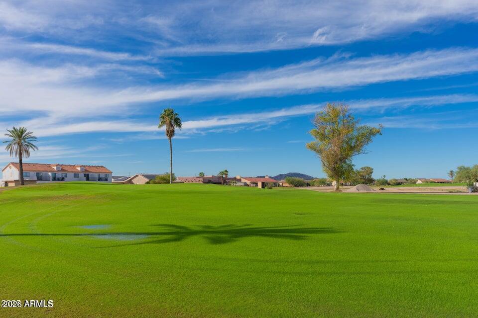 14833 South Brook Hollow Road Arizona City, AZ 85123 - Photo 57 of 61 a view of a golf course with a lake
