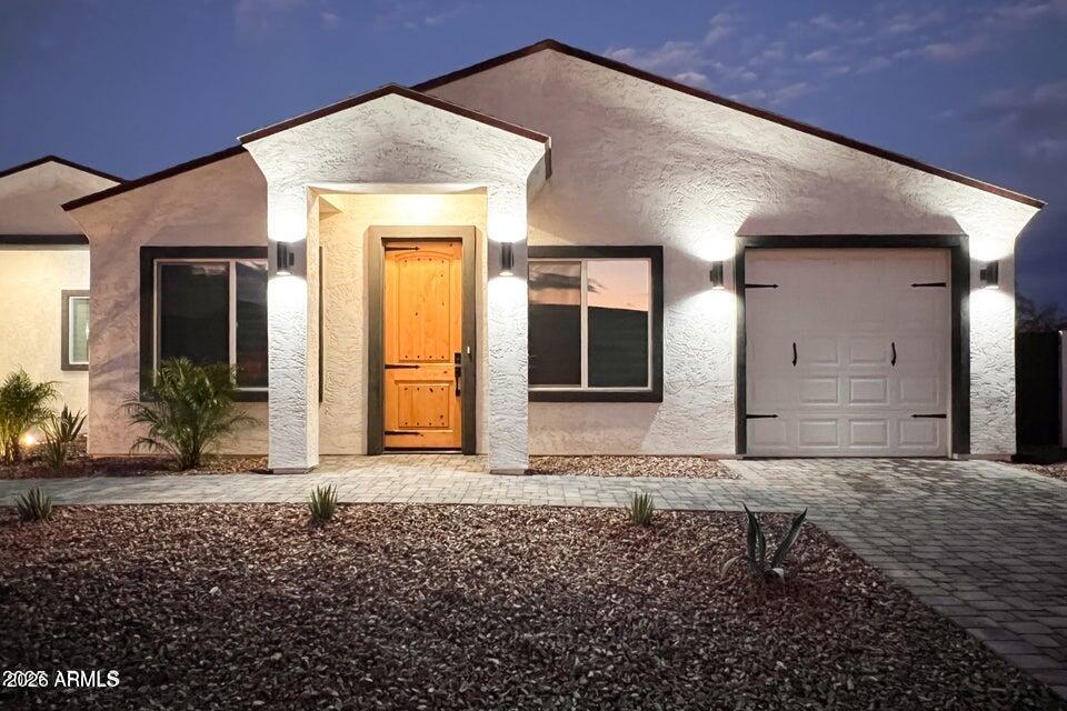 14833 South Brook Hollow Road Arizona City, AZ 85123 - Photo 6 of 61 a front view of a house with a yard