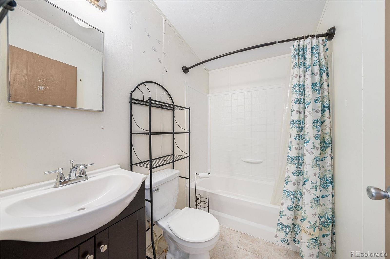 2500 East Harmony Road Fort Collins, CO 80528 - Photo 18 of 23 a bathroom with a sink toilet and shower