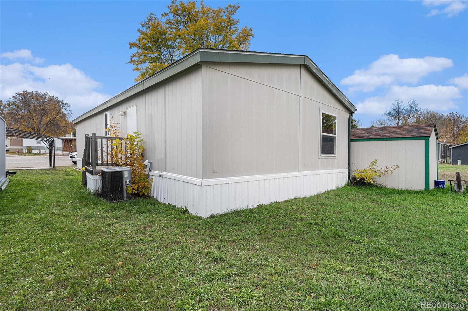 2500 East Harmony Road Fort Collins, CO 80528 - Photo 20 of 23 a view of a house with a yard