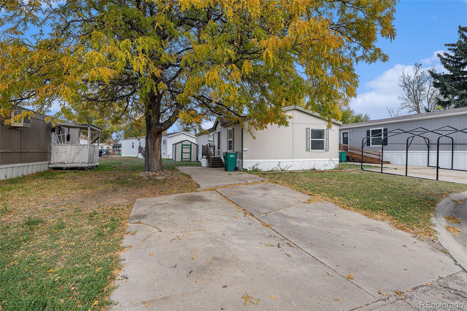 2500 East Harmony Road Fort Collins, CO 80528 - Photo 2 of 23 front view of a house with a yard