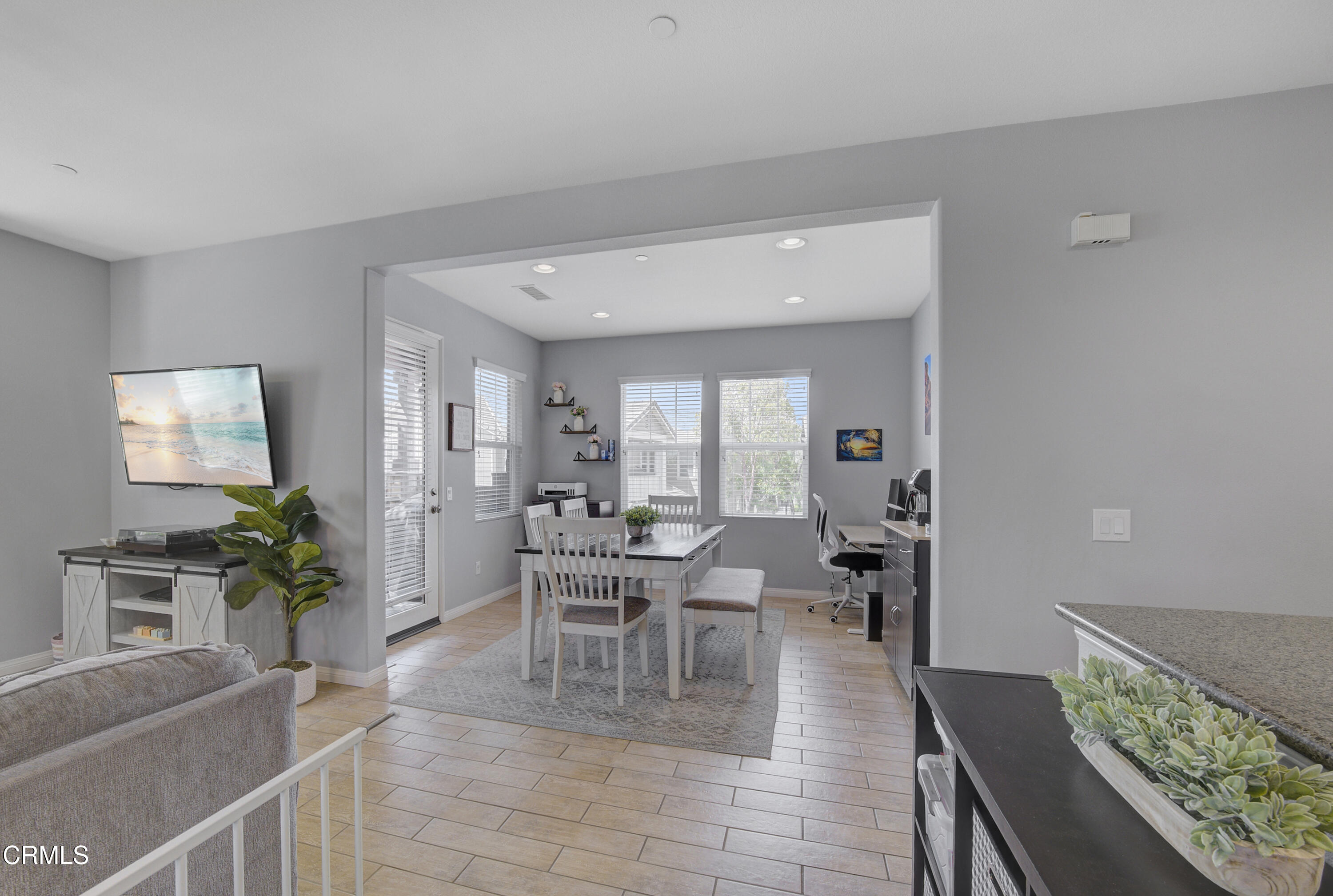 3233 Moss Landing Boulevard Oxnard, CA 93036 - Photo 29 of 57 a dining room with furniture potted plants and wooden floor