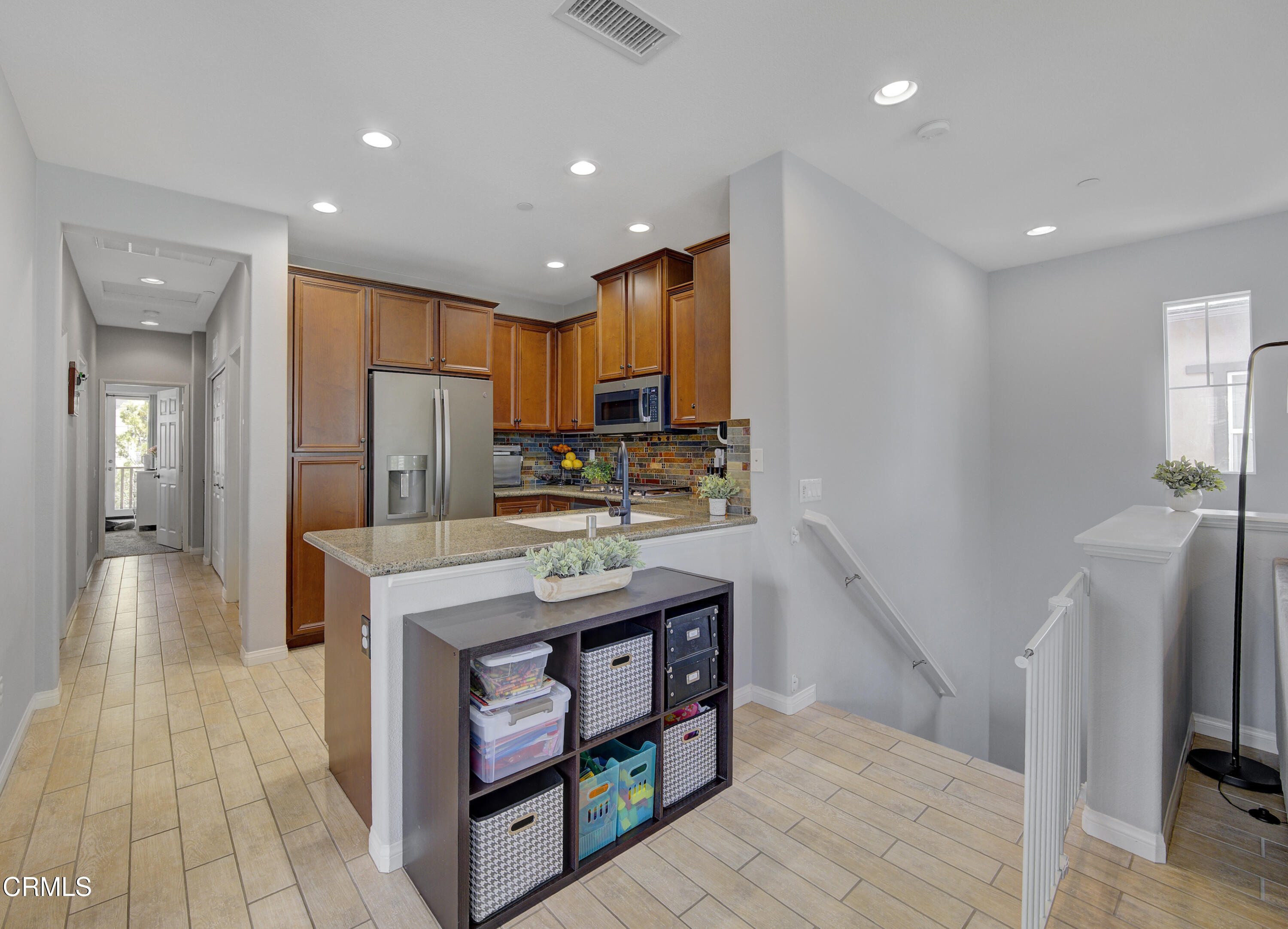 3233 Moss Landing Boulevard Oxnard, CA 93036 - Photo 32 of 57 a kitchen with stainless steel appliances granite countertop a refrigerator a stove and a sink