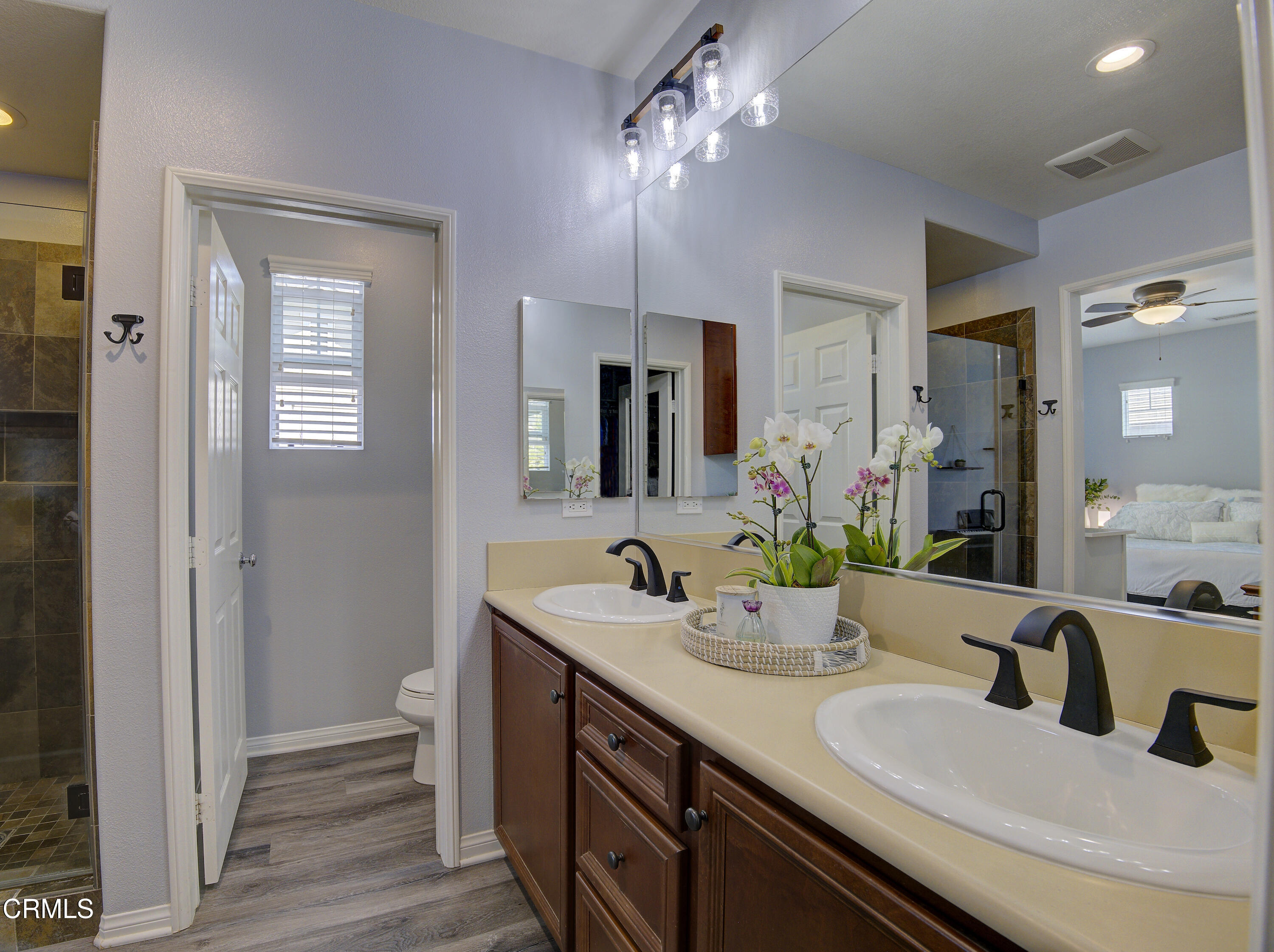 3233 Moss Landing Boulevard Oxnard, CA 93036 - Photo 36 of 57 a bathroom with a double vanity sink and a mirror