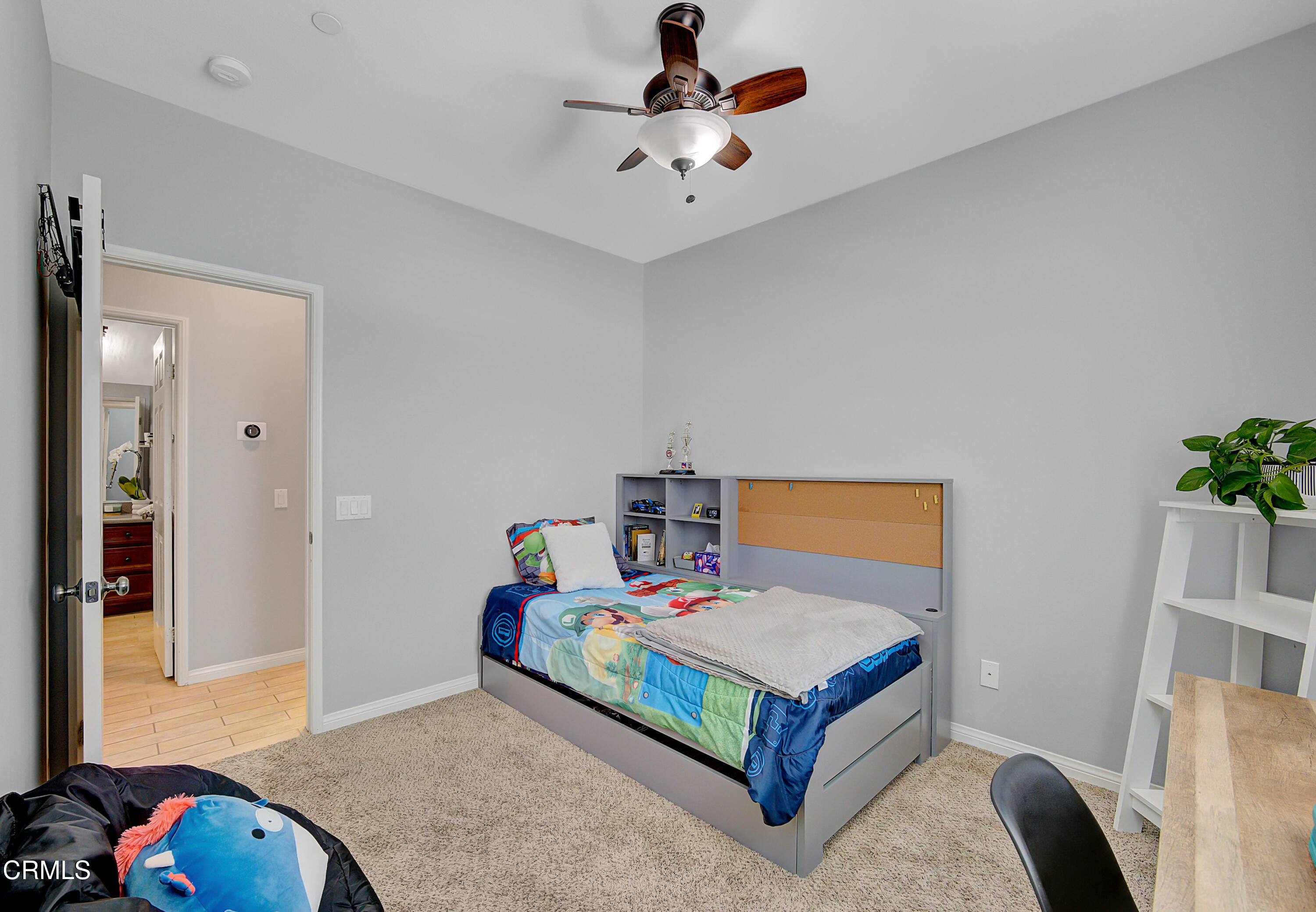 3233 Moss Landing Boulevard Oxnard, CA 93036 - Photo 38 of 57 a bedroom with a bed and a chandelier