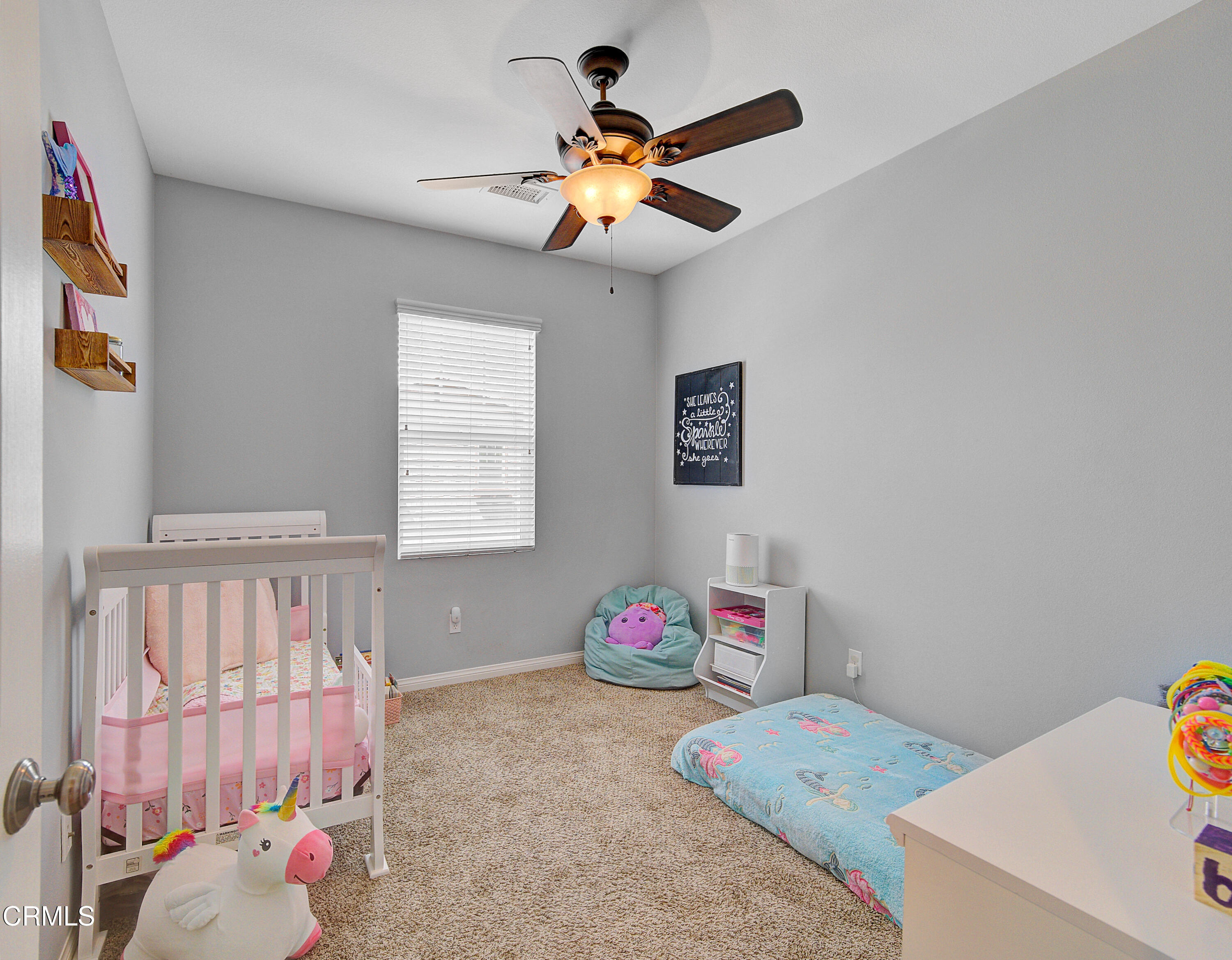 3233 Moss Landing Boulevard Oxnard, CA 93036 - Photo 41 of 57 a bedroom with a bed and a chandelier