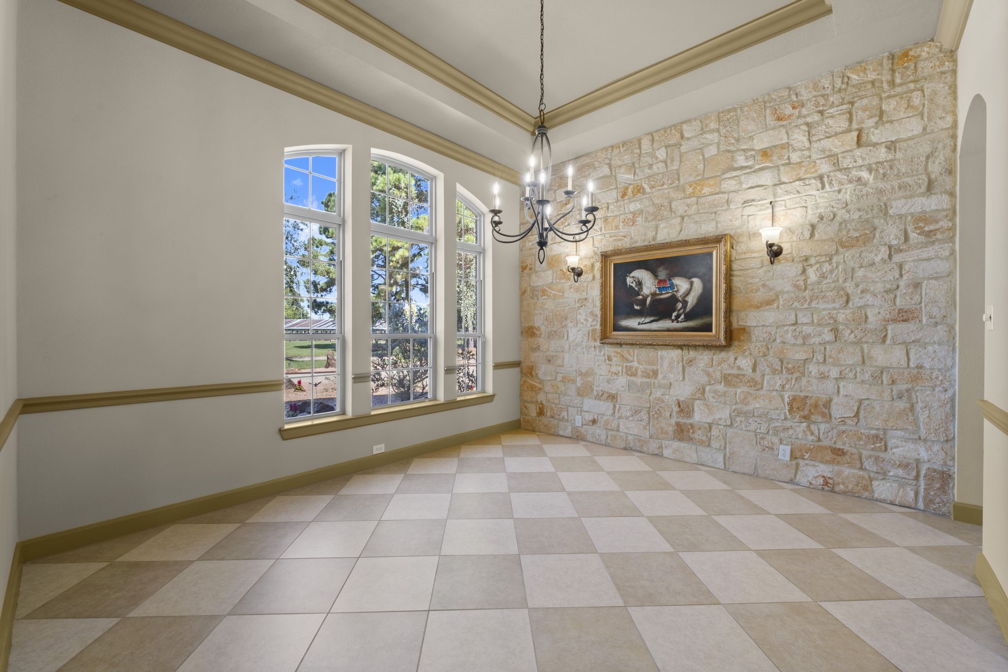 1534 Virgie Community Road Magnolia, TX 77354 - Photo 11 of 50 An Austin limestone wall mixed with amazing crown molding and natural light make this fine dining room an important space in your new home. What style dinner table set would you buy for this room?