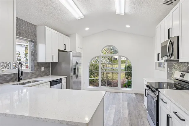 a workspace with furniture and wooden floor