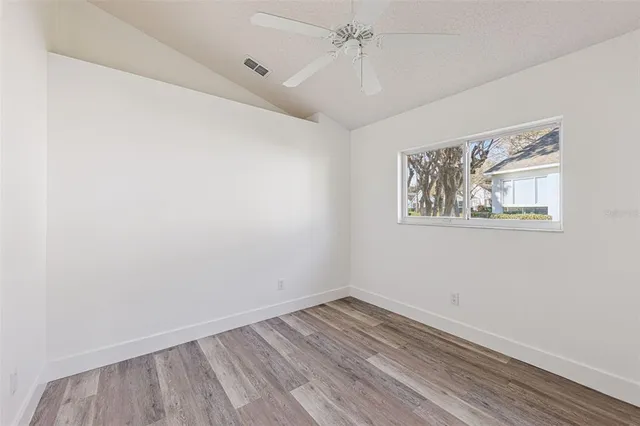 a view of a house with backyard and garden