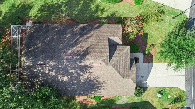 an aerial view of residential houses with swimming pool and outdoor space
