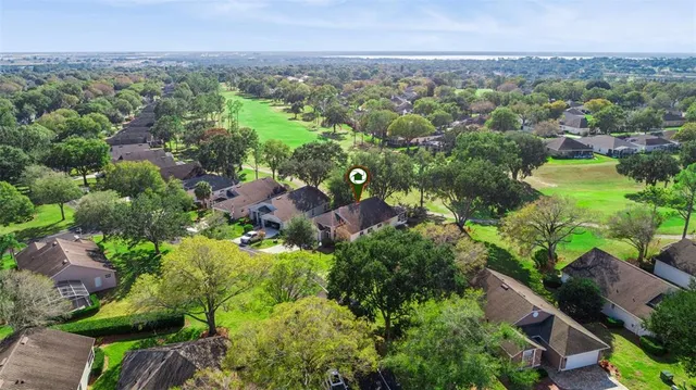 an aerial view of a house with a swimming pool